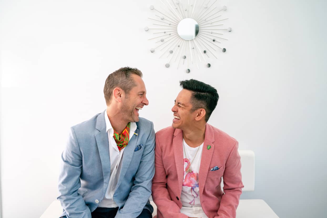two-men-laughing-while-wearing-super-cute-suits-6CVV3Y6