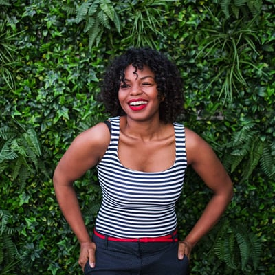 egg donor standing in front of a plant wall