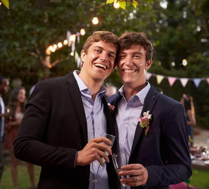 gay-couple-celebrating-wedding-with-party-in-backy-PF6WEGR-1